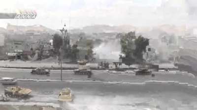 Syrian armored column moves through Damascus firing while civilian traffic weaves in and out - 2013