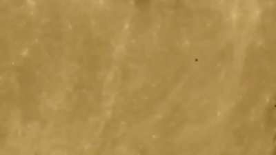 Fleet of UFOs flying across the moon (sighted in Russia)