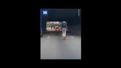 Driving a scooter at 60 mph on the highway