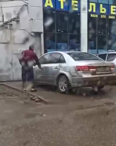 Don't smash this guy's car with a hammer and then walk in front of it