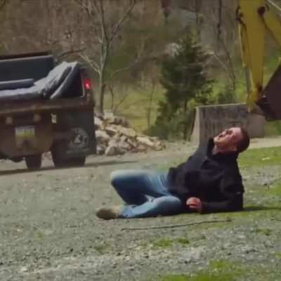 Guy jumped off the roof and tried to land on the back of the moving vehicle