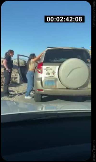 An officer questioning someone