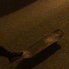 A friend of mine learns a new skateboarding trick.