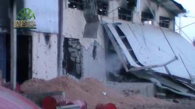 Opposition fighters sneak improvised explosives into know SAA positions during fighting in Adra - 4/10/2014