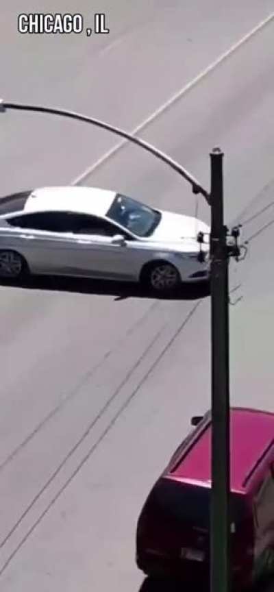 He threw a rock at a car. Gets hit by the car.