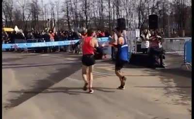 Runners Rinas Akhmandeev and Iskander Yadgarov are headed into a tie. They play rock, paper, scissors to decide who wins the race.