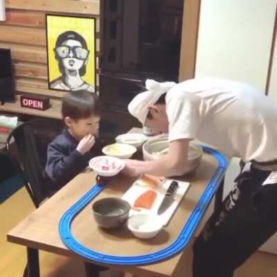 Dad made son a conveyor belt in the kitchen to brighten the quarantine mood