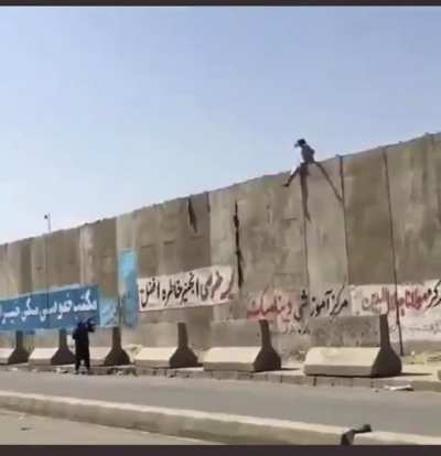 Taliban insurgent shoots man climbing over wall at Kabul Airport