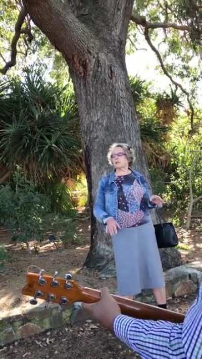 Woman lectures Christian band playing in public place