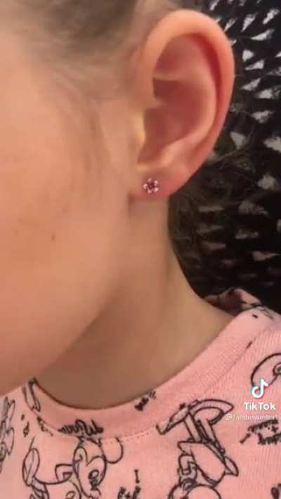 Getting her ears pierced