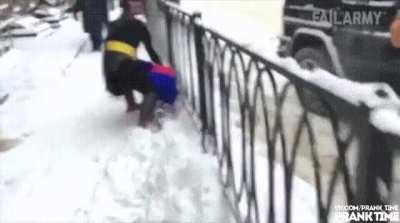 Batman vs Spiderman fighting in the snow