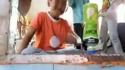 random kid doing reverse bottle flip