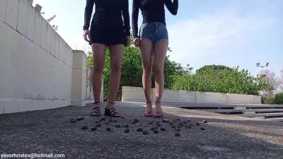 Girls crush snails