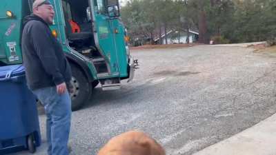Garbage man surprises his little super fan
