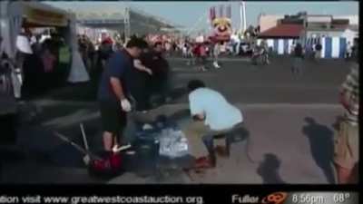 Reporter knocks over a man’s ice sculpture.