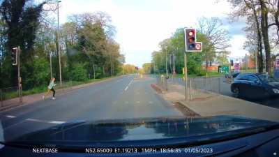 Kid trying to cross the road, thinking both lights were red