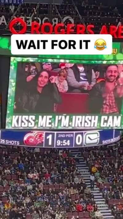 Couples kissing on kiss cam