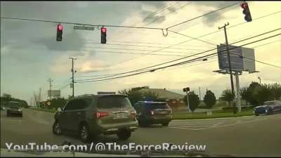 Woman tries to run over a bunch of people and breaks her car and flees police.