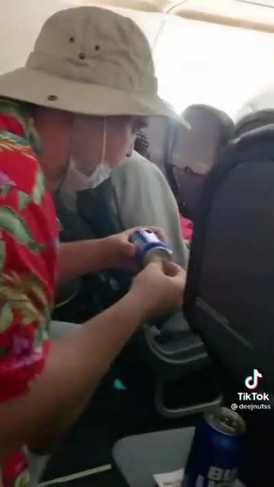 Shotgunning beers on a 7am flight