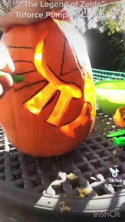I carved a Zelda-themed Triforce pumpkin today! :D