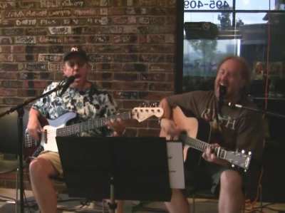 Wait for it! , 2 middle-aged guys playing in the corner of a pizzeria in Utah.