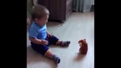 A baby and the hamster