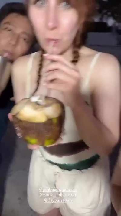Enjoying a coconut 