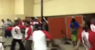 Woman throws table at mob, blocks one chair, catches the other, all while holding her purse