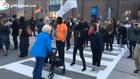 Woman blocks the path of an elderly lady trying to cross the street and repeatedly calls her a nazi