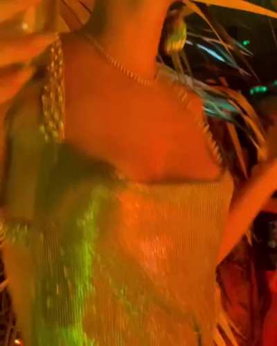 In golden dress, NYE