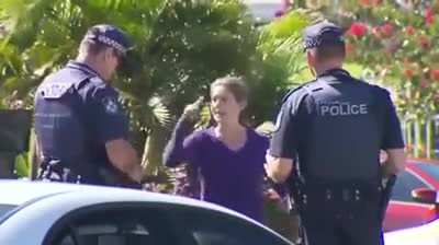 Entitled woman throws her dog poop at an officer for not wanting to follow directions for her safety