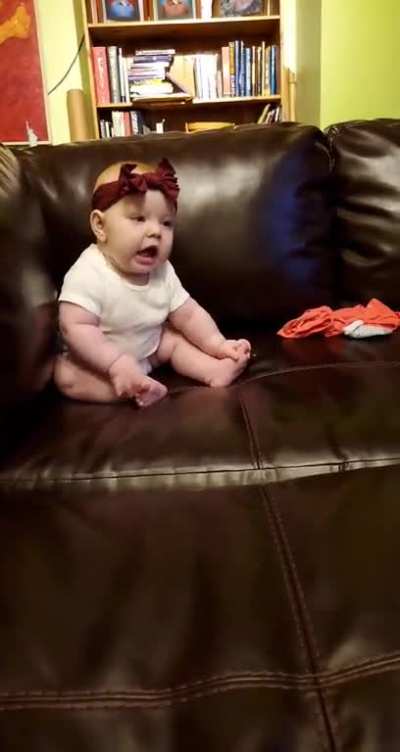 making goofy noises with the baby