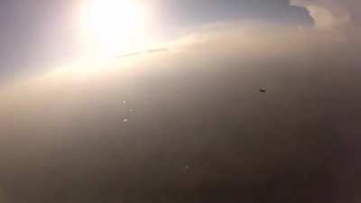 Two skydivers collide mid-air, knocking one of them unconscious. Camera man proceeds to pull some mission impossible shit and saves his life.