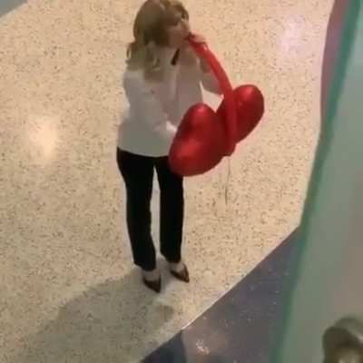That's a lot of balloon coming out of her mouth