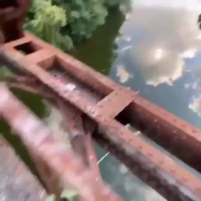 Rope swing into the river