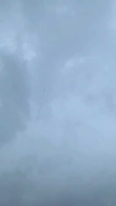 A bolt of lightning through a rocket trail