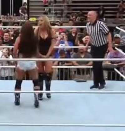 Mickie James gives Allie a painful crotch claw