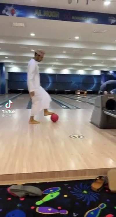 Helping a friend to score a strike.