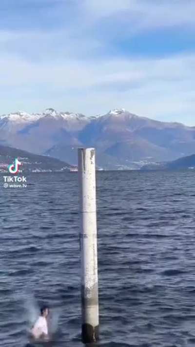 To backflip off of a post in the ocean