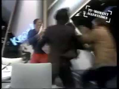 Fight on dutch talk show, the Karel de Graaf show. Surinamese politician, Paul Somohardjo gets into an argument with an audience member about the regime in Suriname. Blue shirt guy comes back with a gun and injured two. The show was cancelled. (Dec, 3 198