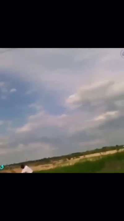 Guy throws rocks covered in copper wire at a power line, wonder what happens?
