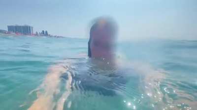 Kseniya blows bubbles under the sea