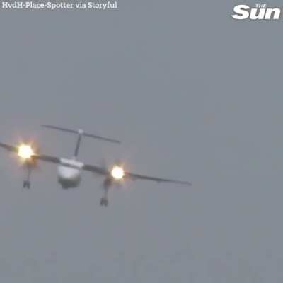 Dusseldorf Airport- Pilot expertly lands propeller plane in heavy crosswinds.