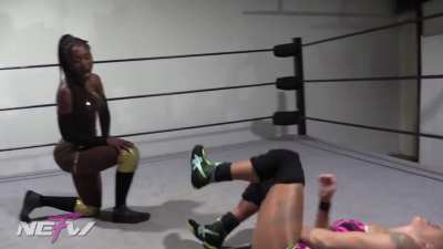 Dani Mo receives an atomic drop from Queen Aminata