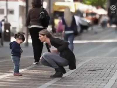 Lady helping a kid not to get lost..