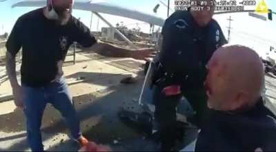 Police drag a man from a planet crash, which is then obliterated by a train