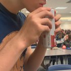 my friend taste testing the new flavor of sparkling water the school started selling back in january
