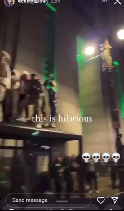 Philadelphia Eagles fans fall through bus shelter during victory celebration