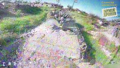 Ukrainian FPV loitering drone targets a Russian BTR backing up (Music from source)