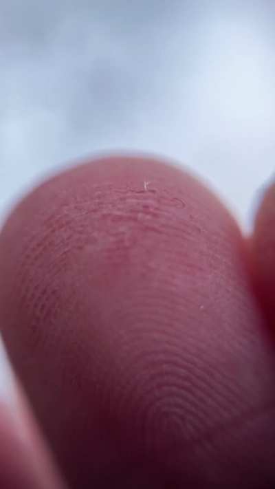 Snowflake melting on my fingertip ❄️ [OC]